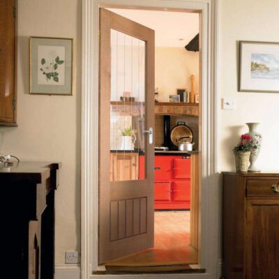 Howdens Dordogne Oak clear glazed internal door fitted in a home