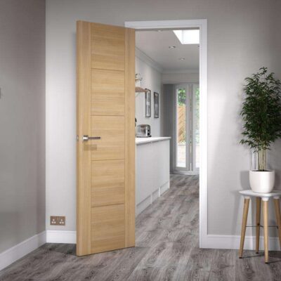 Howdens Daytona Oak internal door fitted in a modern hallway