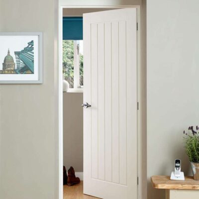 Howdens Dordogne white smooth moulded internal door fitted in a bright room