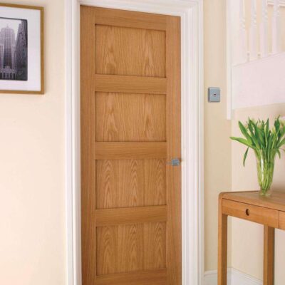 Howdens Shaker Oak four-panel internal door fitted in a hallway